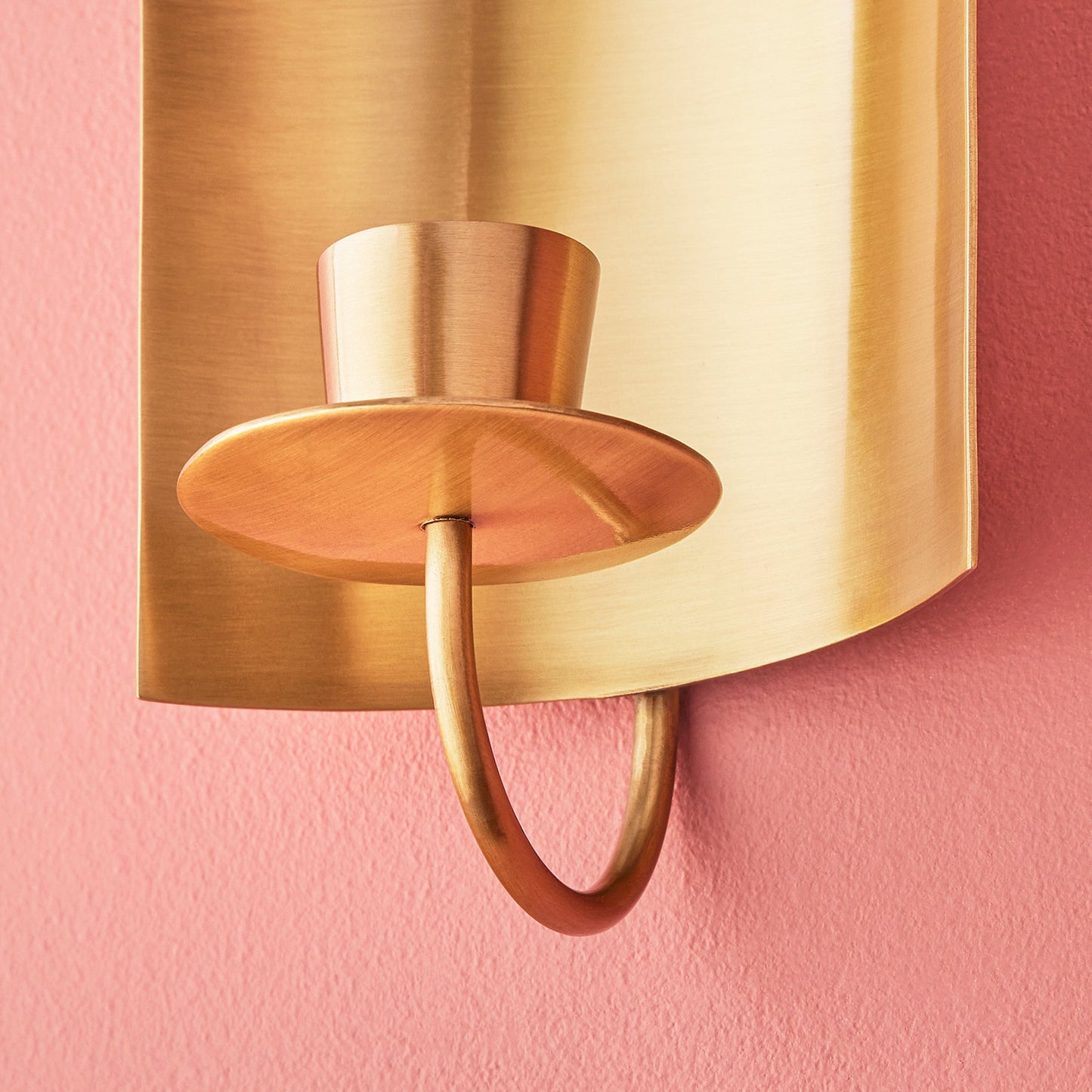 Pitti wall mounted candle holder in antiqued brass