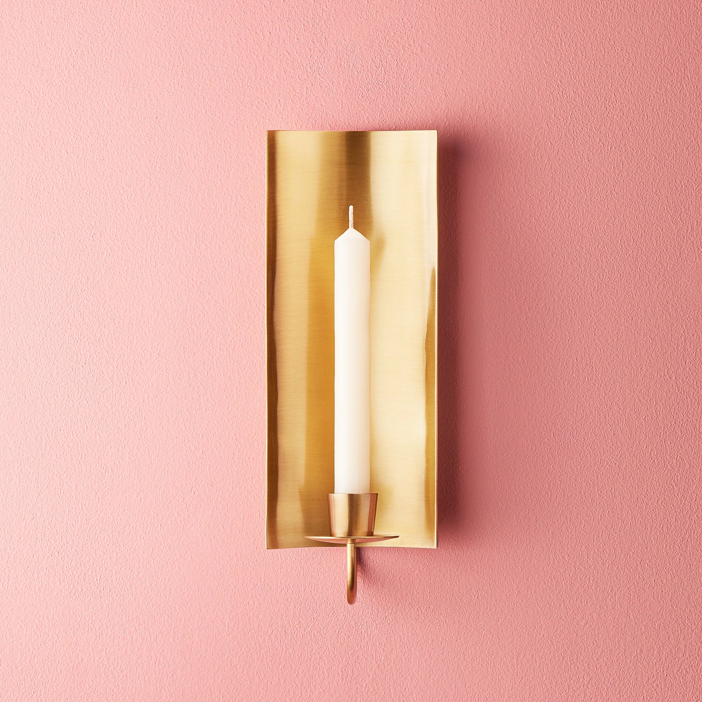 Pitti wall mounted candle holder in antiqued brass