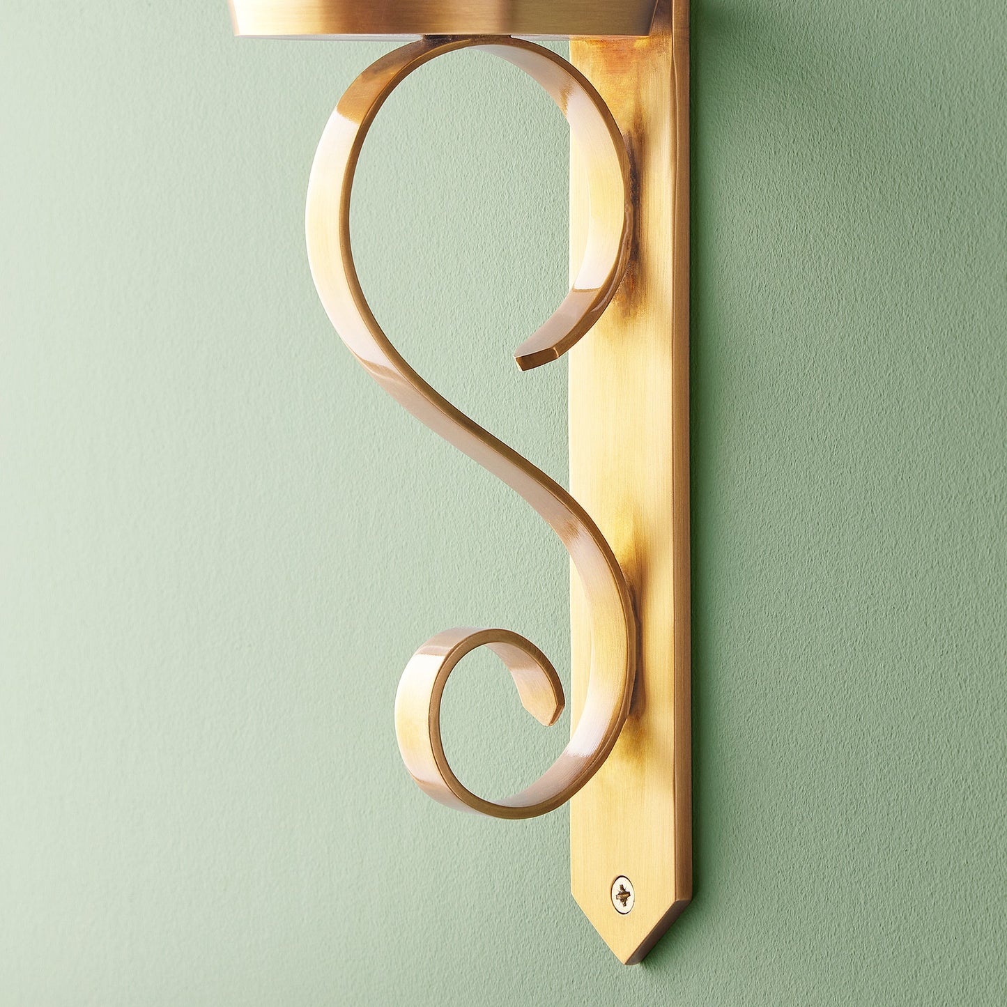 Tivoli wall mounted candle holder in antiqued brass