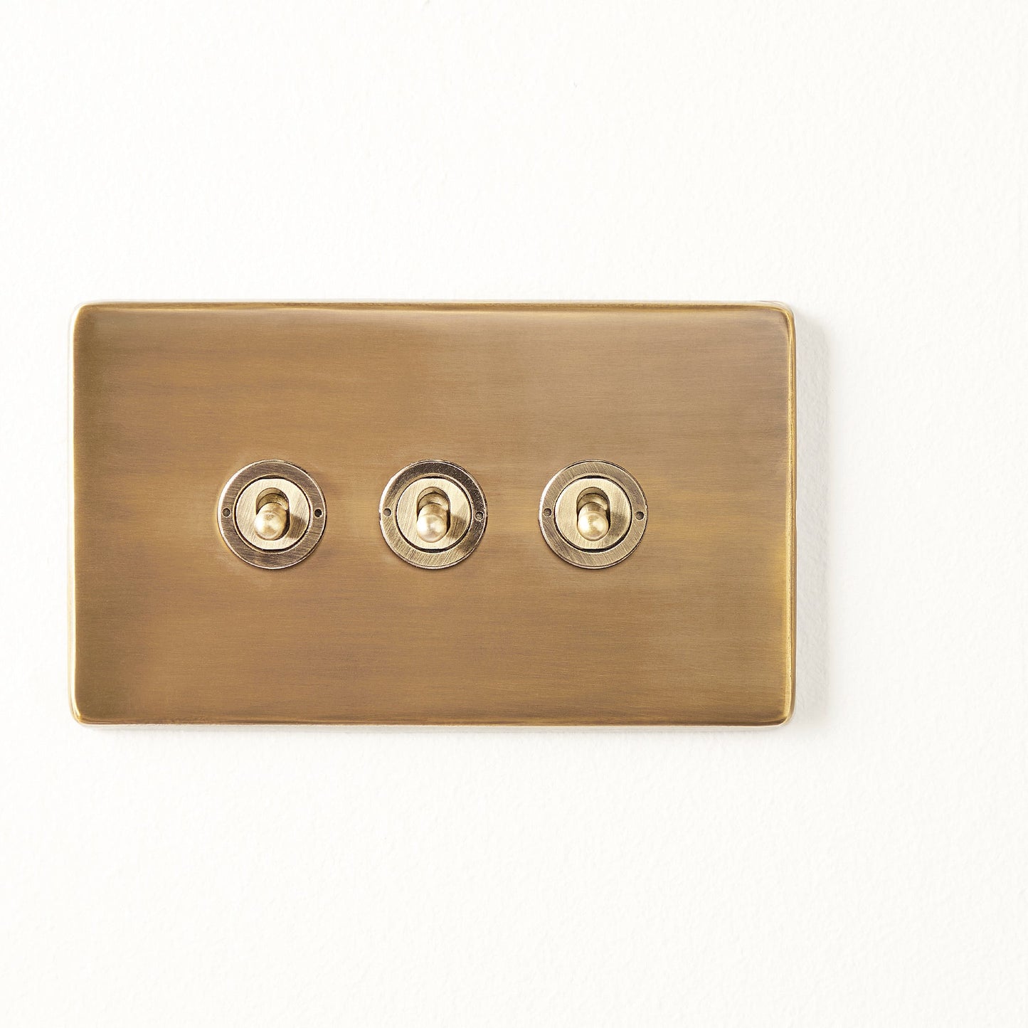 Three gang 2 way Florence toggle switch in brass