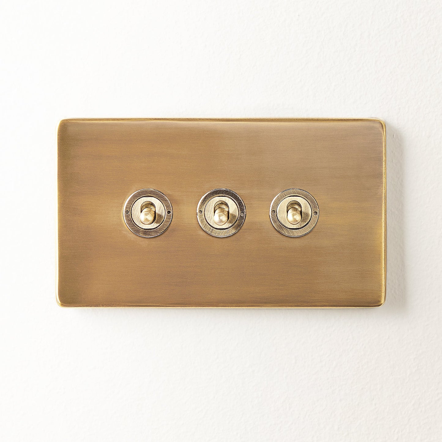 Three gang 2 way Florence toggle switch in brass