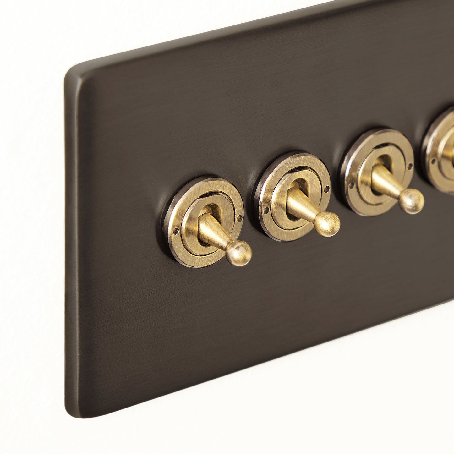 Four gang 2 way Florence toggle switch in bronze