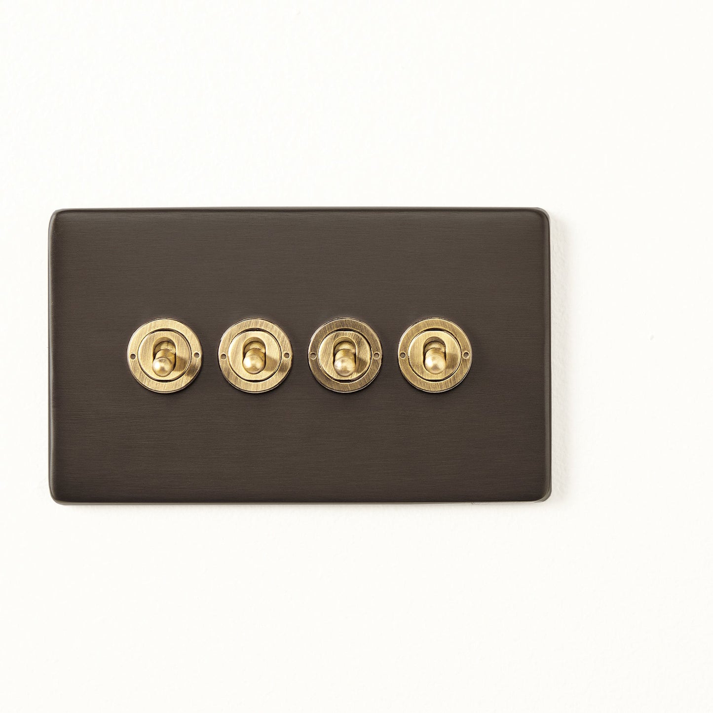Four gang 2 way Florence toggle switch in bronze