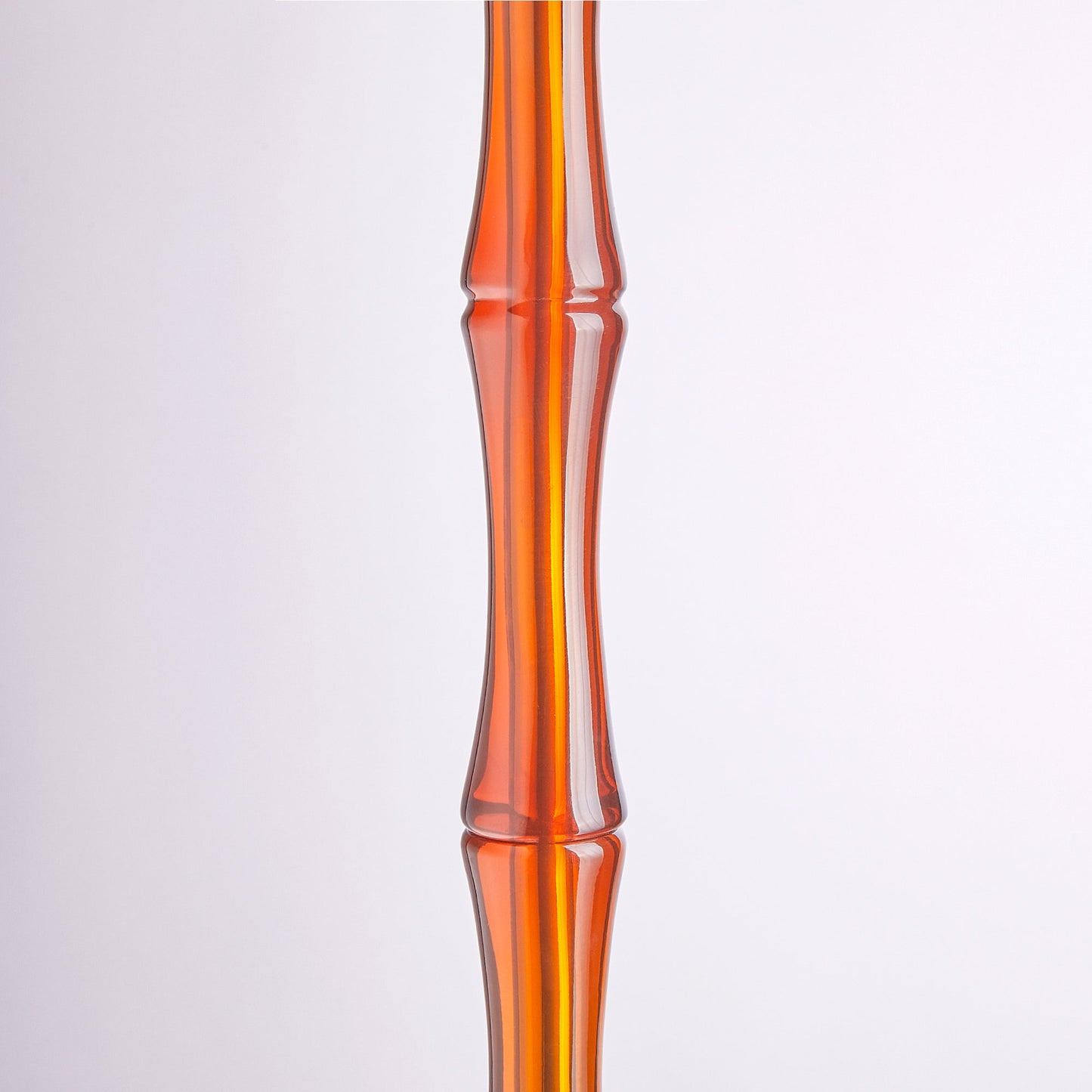 Bamboo floor lamp in amber polished resin