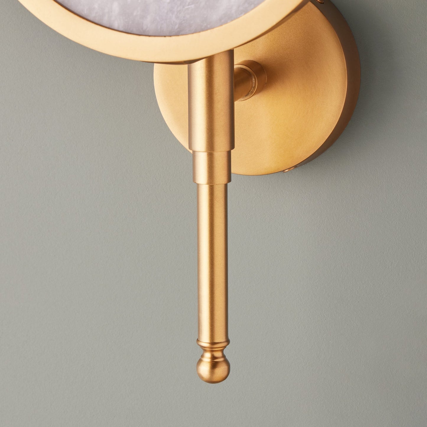 Firefly wall light in antique brass with an alabaster globe