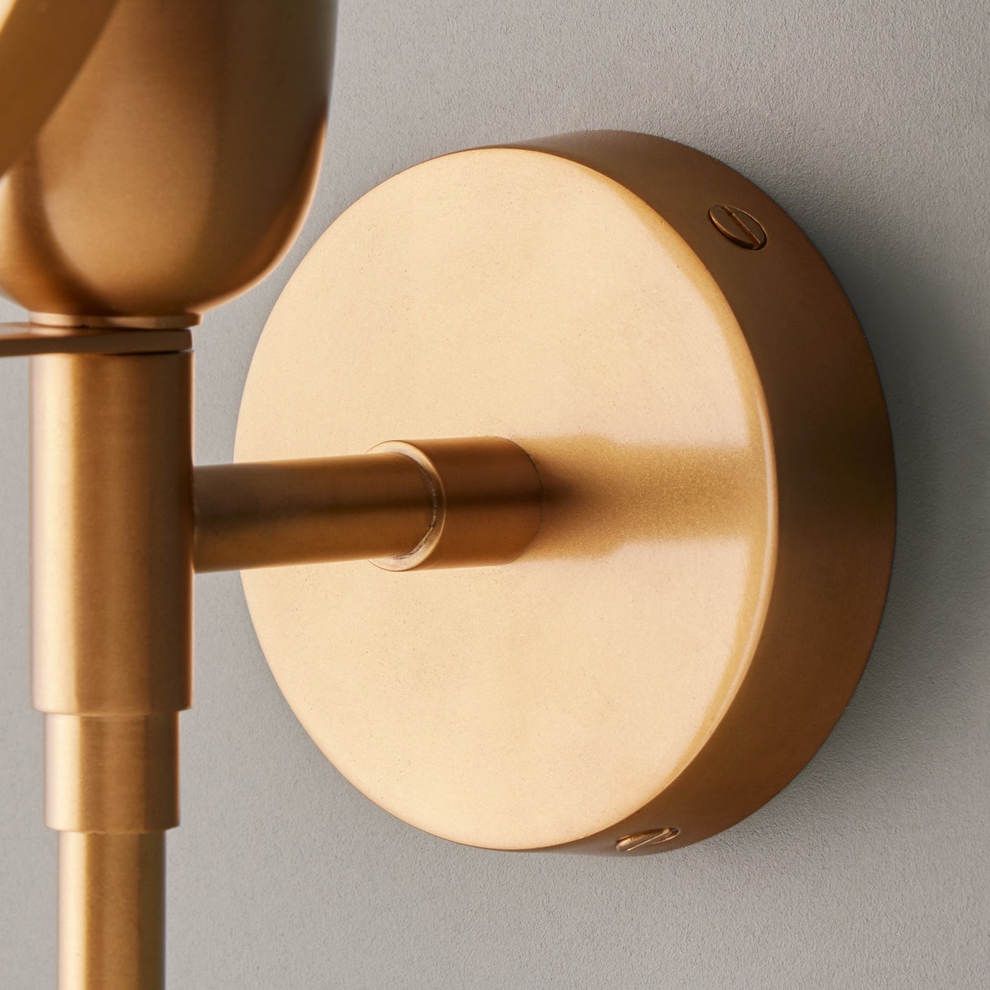 Firefly wall light in antique brass with an alabaster globe