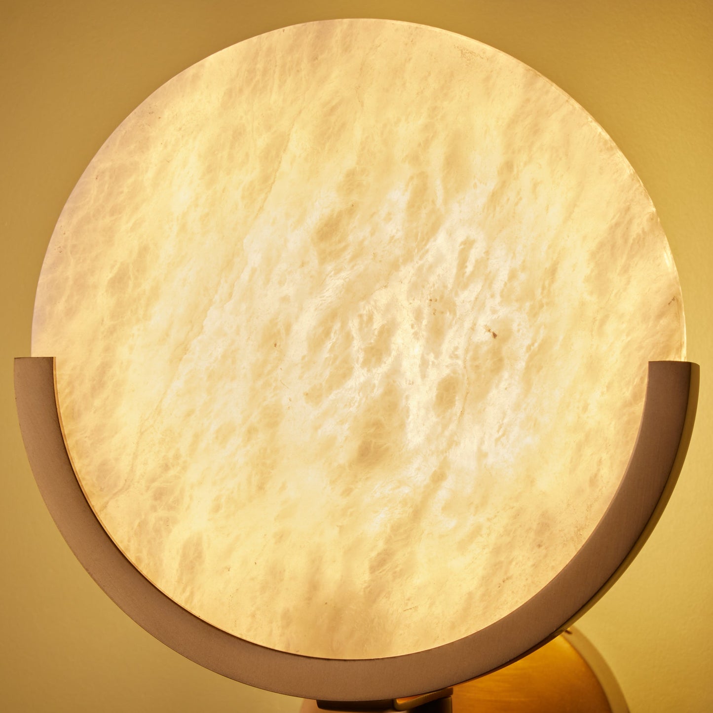 Firefly wall light in antique brass with an alabaster globe
