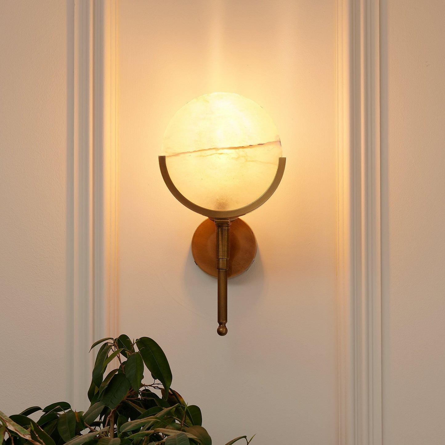Firefly wall light in antique brass with an alabaster globe
