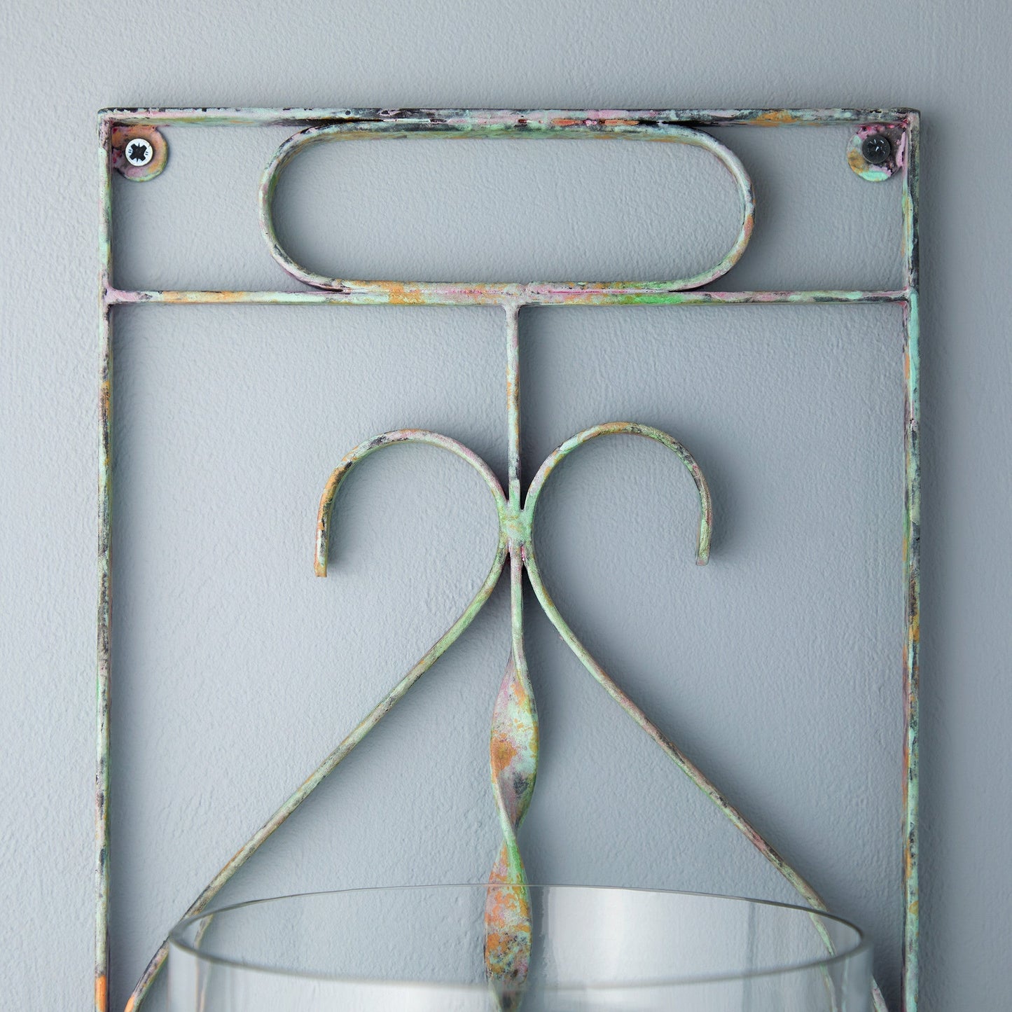 Tor wall mounted candle sconce in verdigris