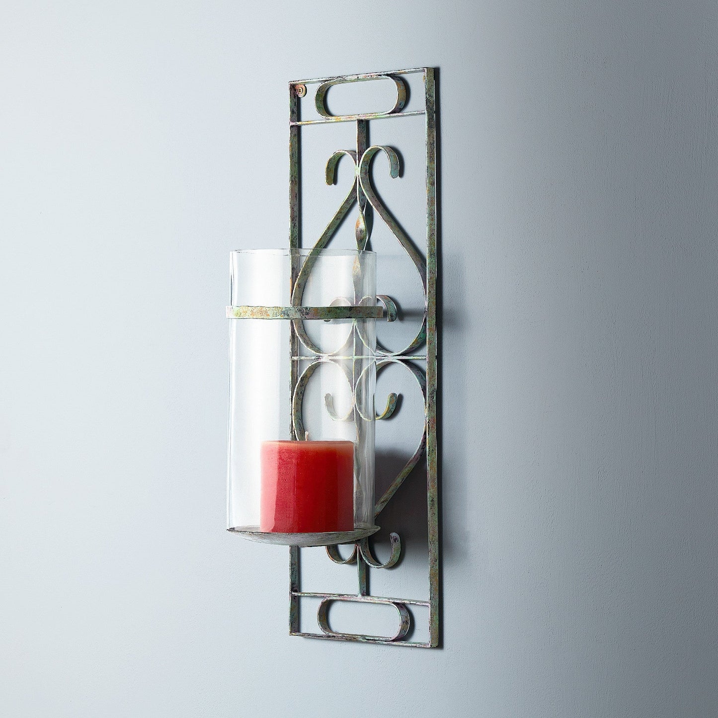 Tor wall mounted candle sconce in verdigris