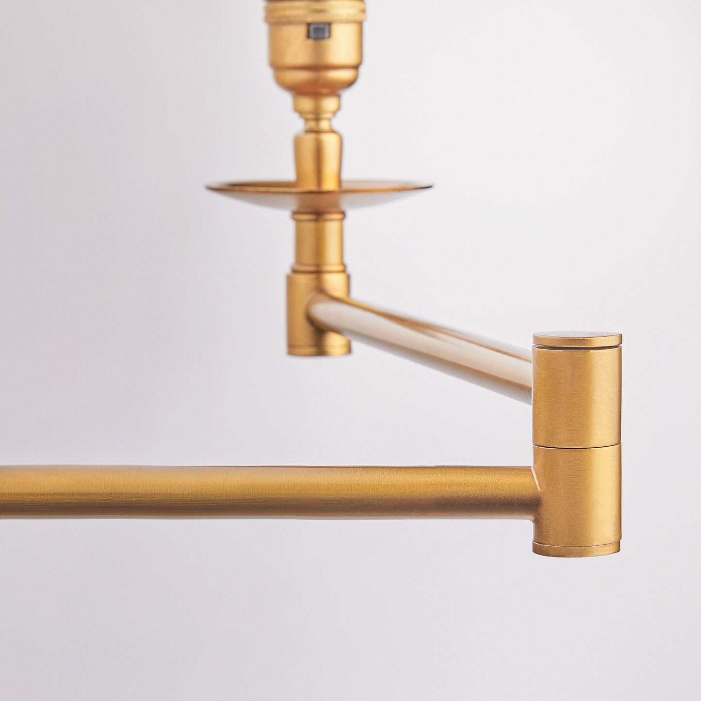 Double Swing standing lamp in antique brass