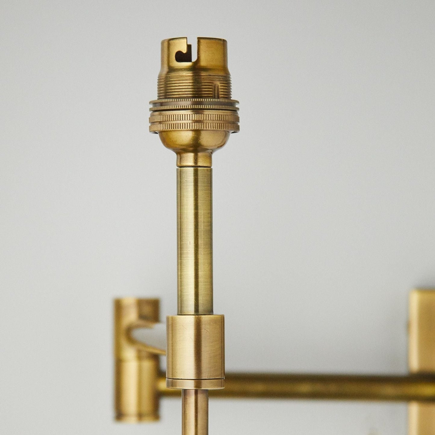 Cagney Wall fitting in antiqued brass