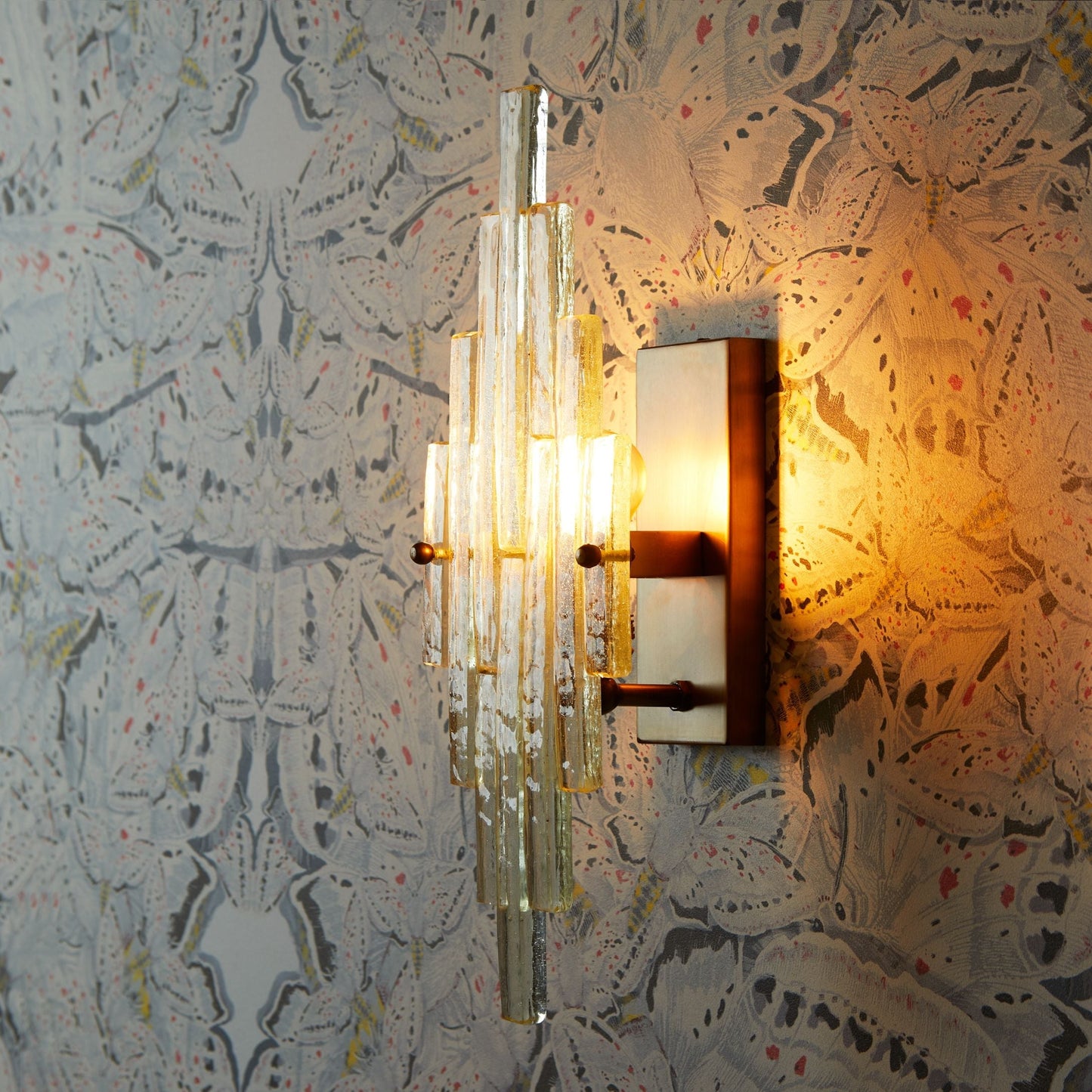 Skystar wall sconce with stepped clear recycled glass strips