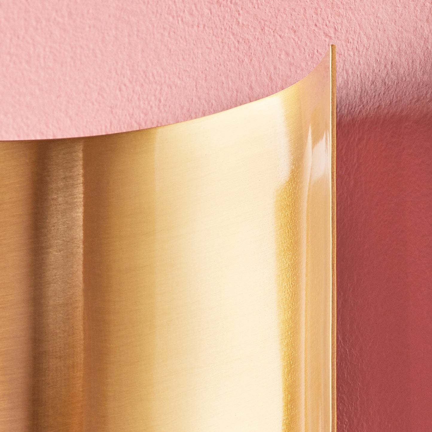 Pitti wall mounted candle holder in antiqued brass