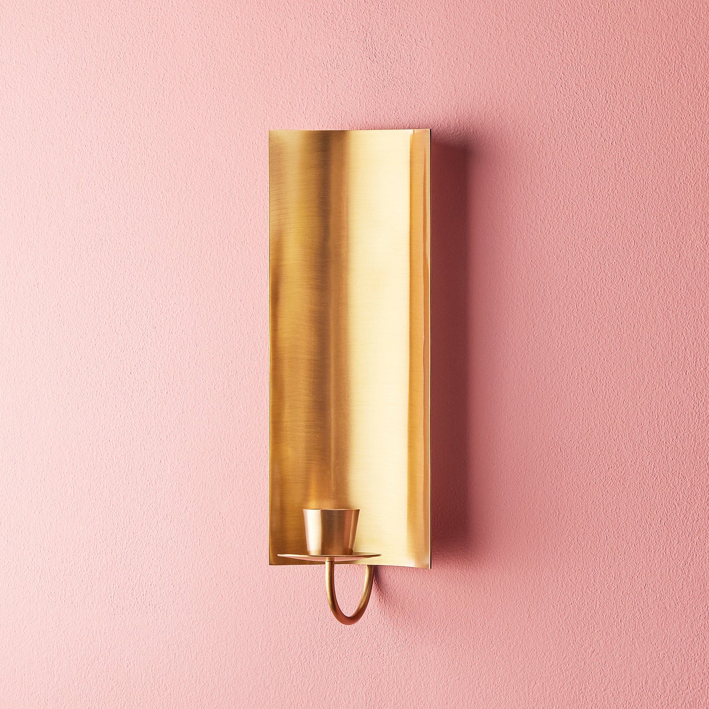 Pitti wall mounted candle holder in antiqued brass