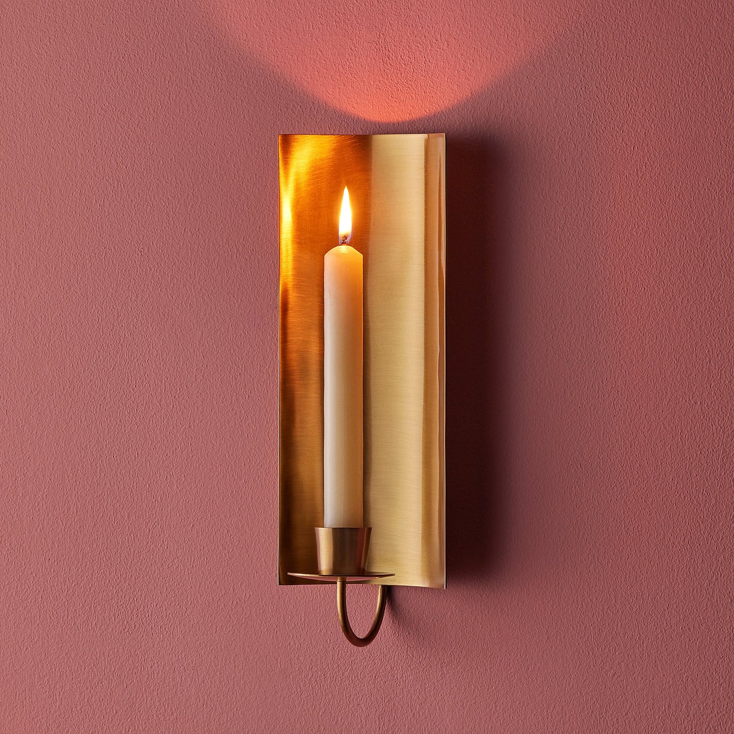 Pitti wall mounted candle holder in antiqued brass
