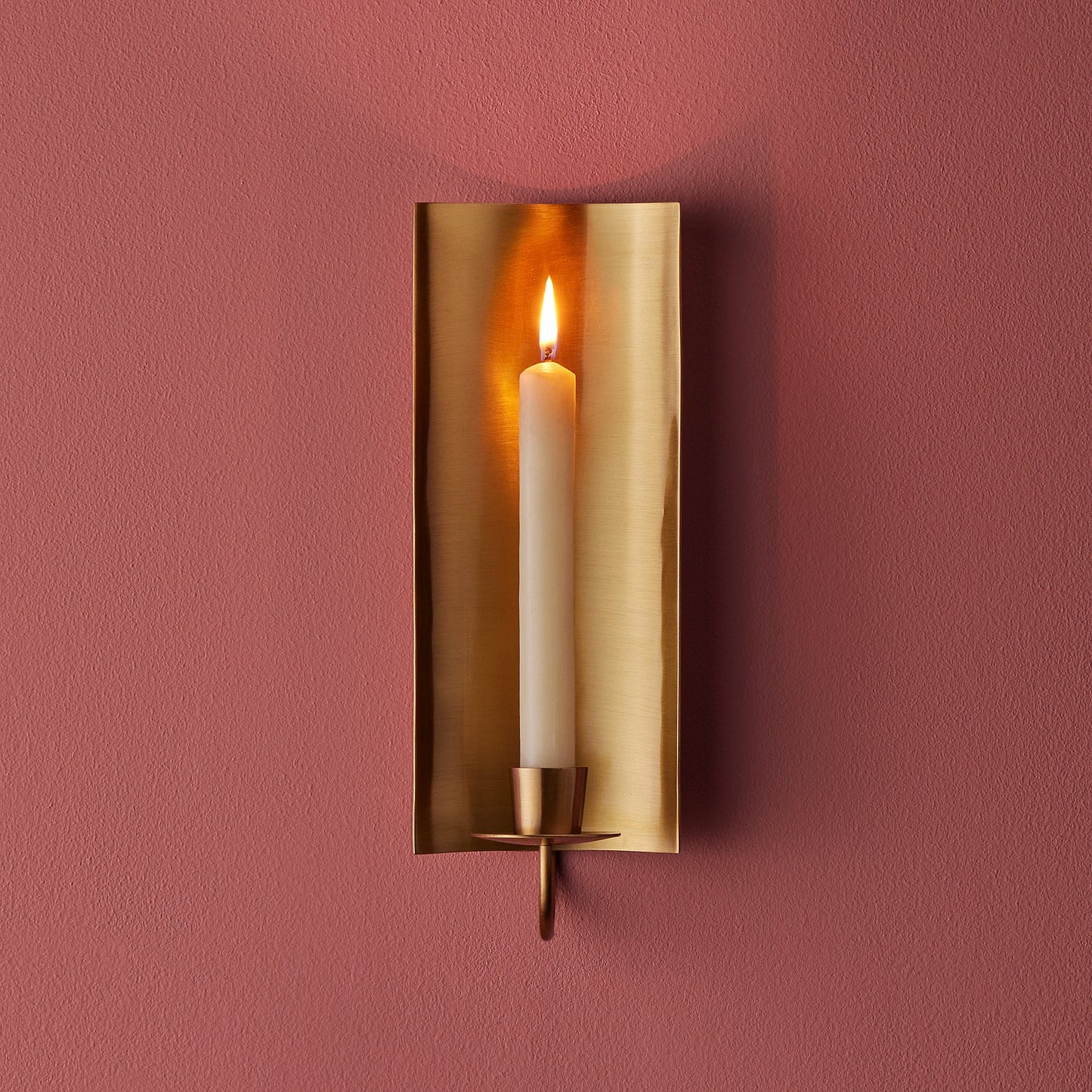 Pitti wall mounted candle holder in antiqued brass