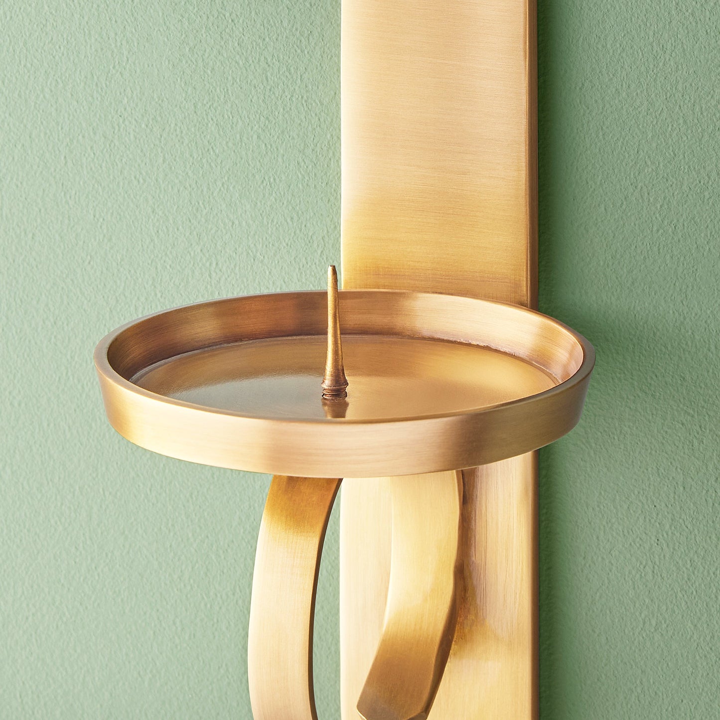 Tivoli wall mounted candle holder in antiqued brass