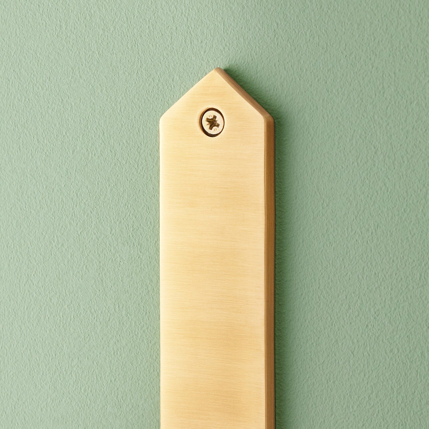 Tivoli wall mounted candle holder in antiqued brass