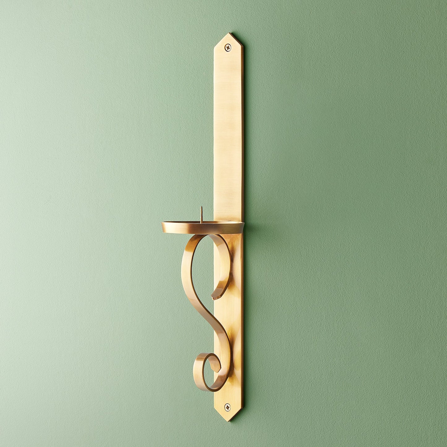 Tivoli wall mounted candle holder in antiqued brass