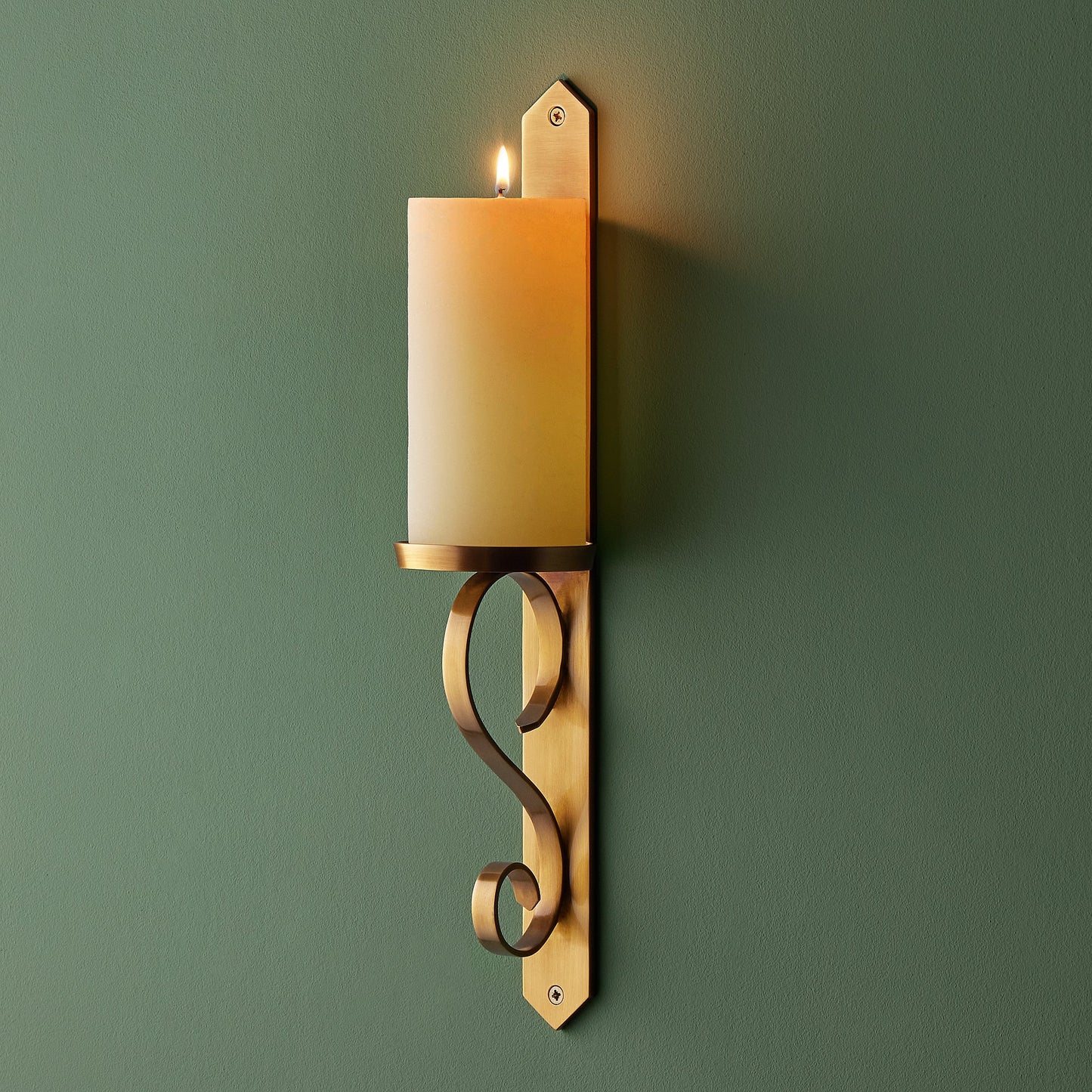 Tivoli wall mounted candle holder in antiqued brass