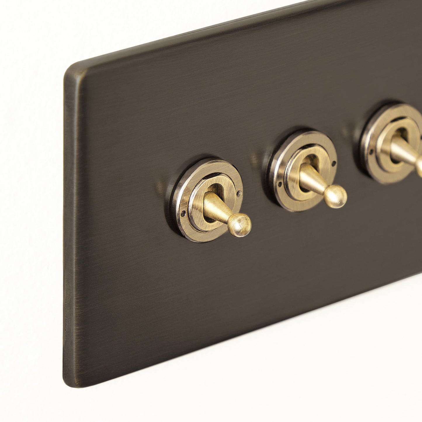 Three gang 2 way Florence toggle switch in bronze