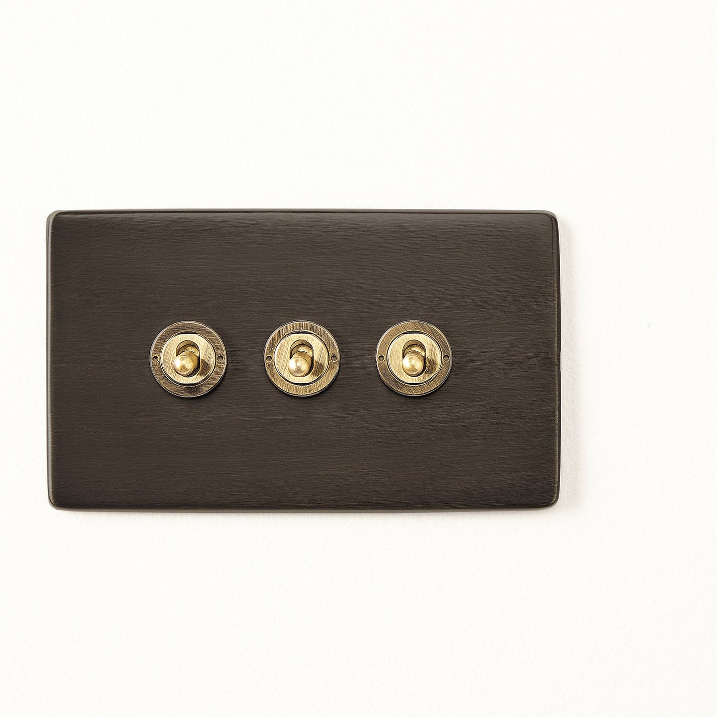 Three gang 2 way Florence toggle switch in bronze