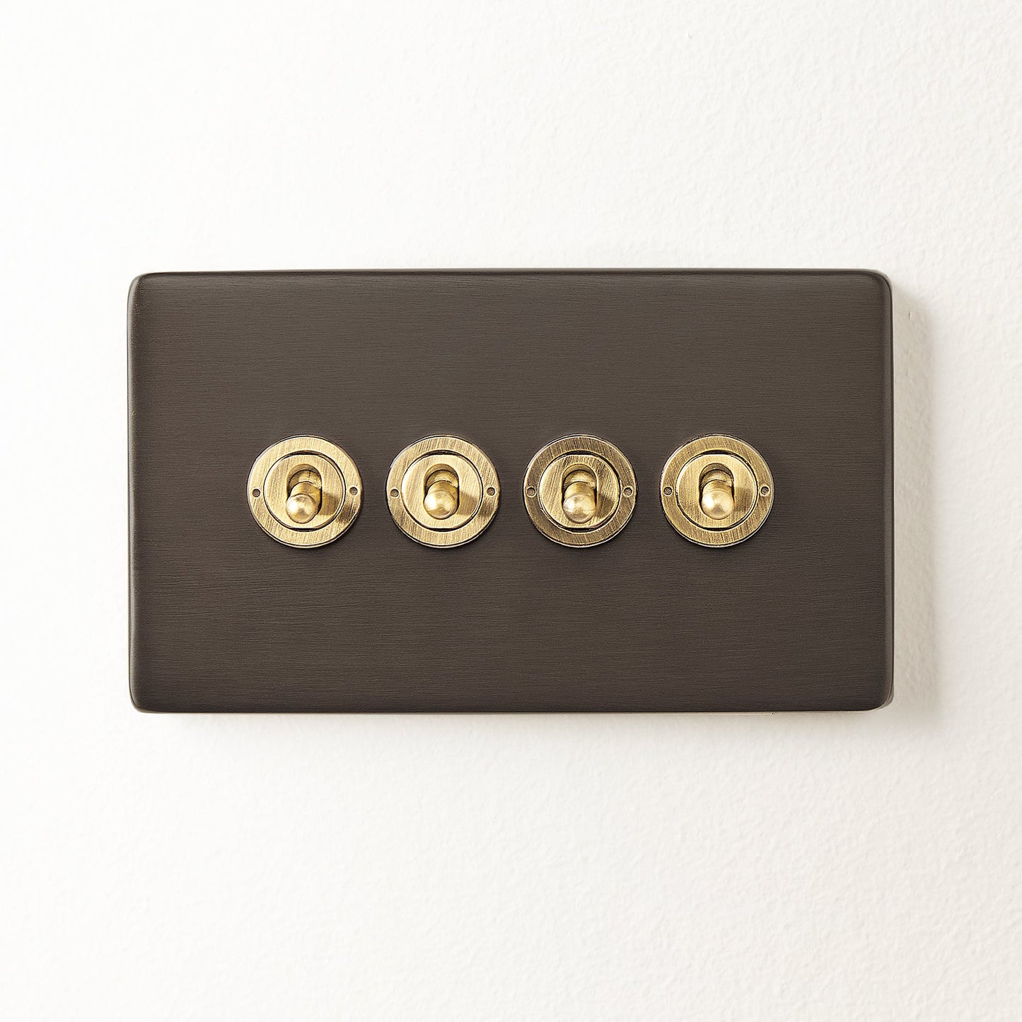 Four gang 2 way Florence toggle switch in bronze