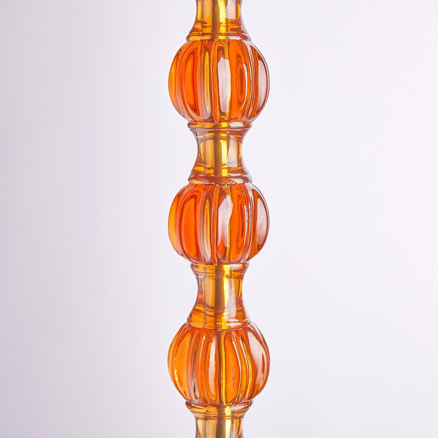 Coronet floor lamp in amber polished resin