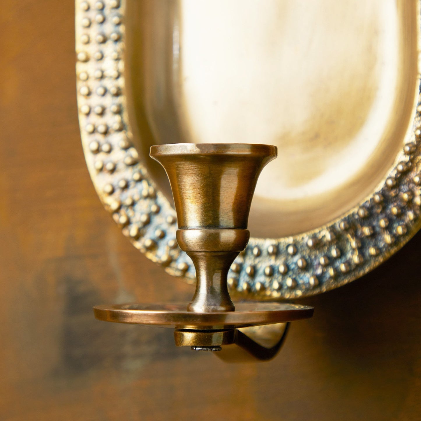 Beacon wall mounted candle holder in antiqued brass