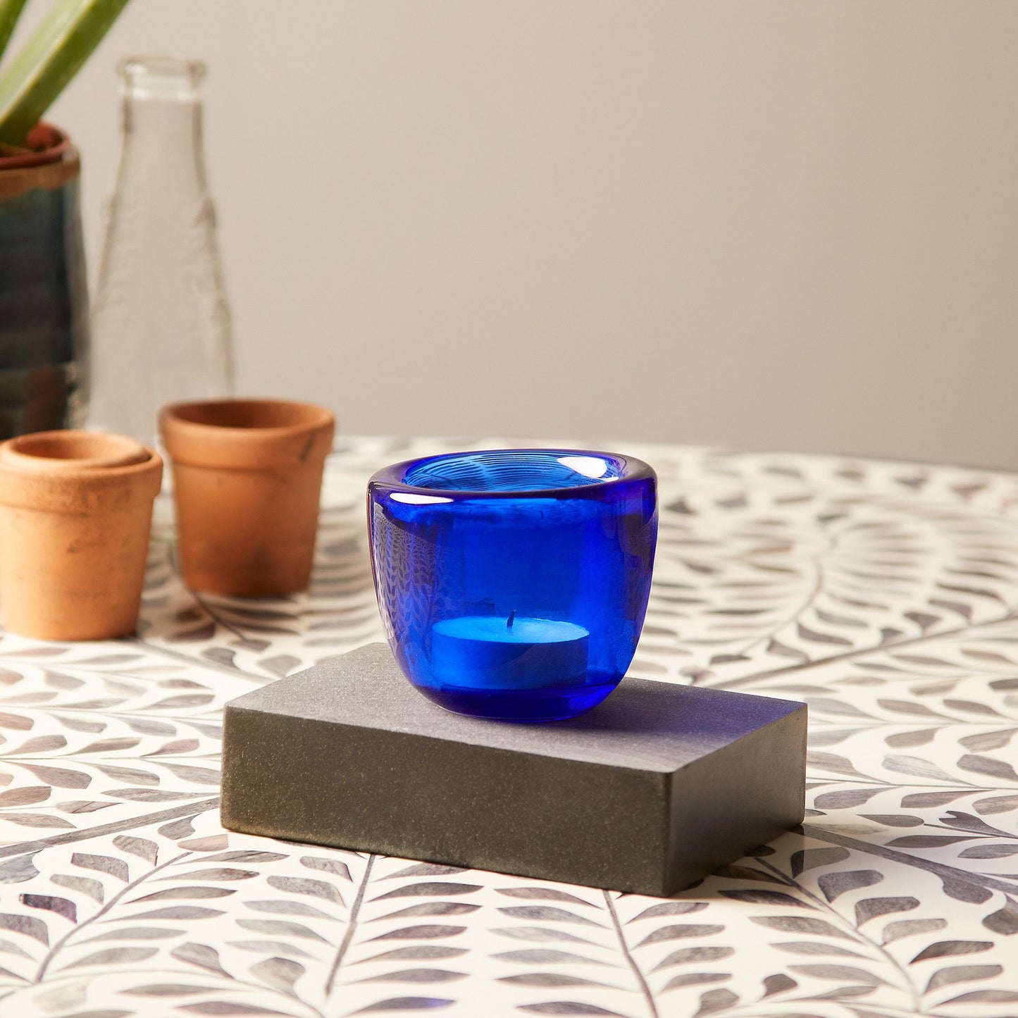 Burly tealight holder in aqua glass