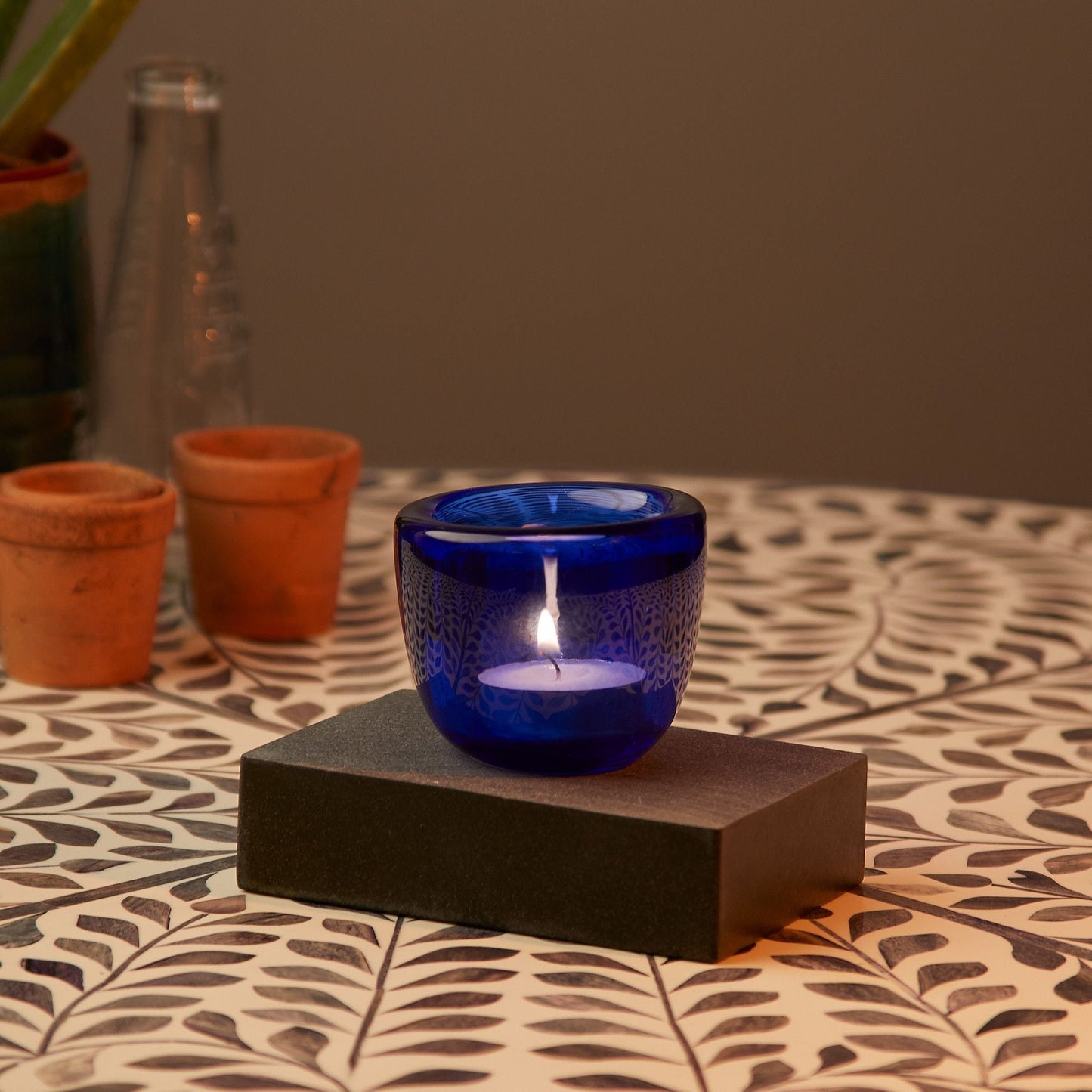 Burly tealight holder in aqua glass