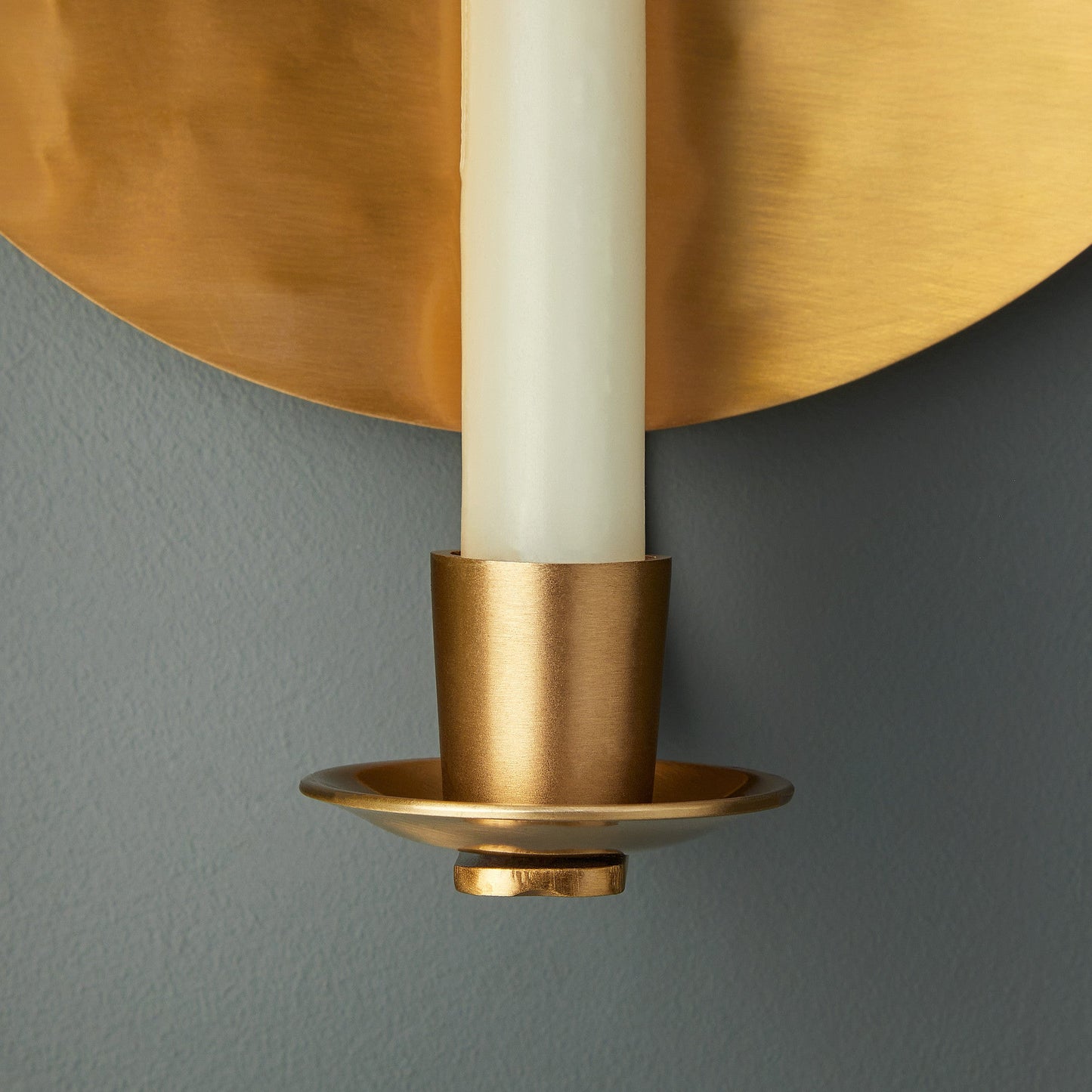 Celeste wall mounted candle holder in antique brass