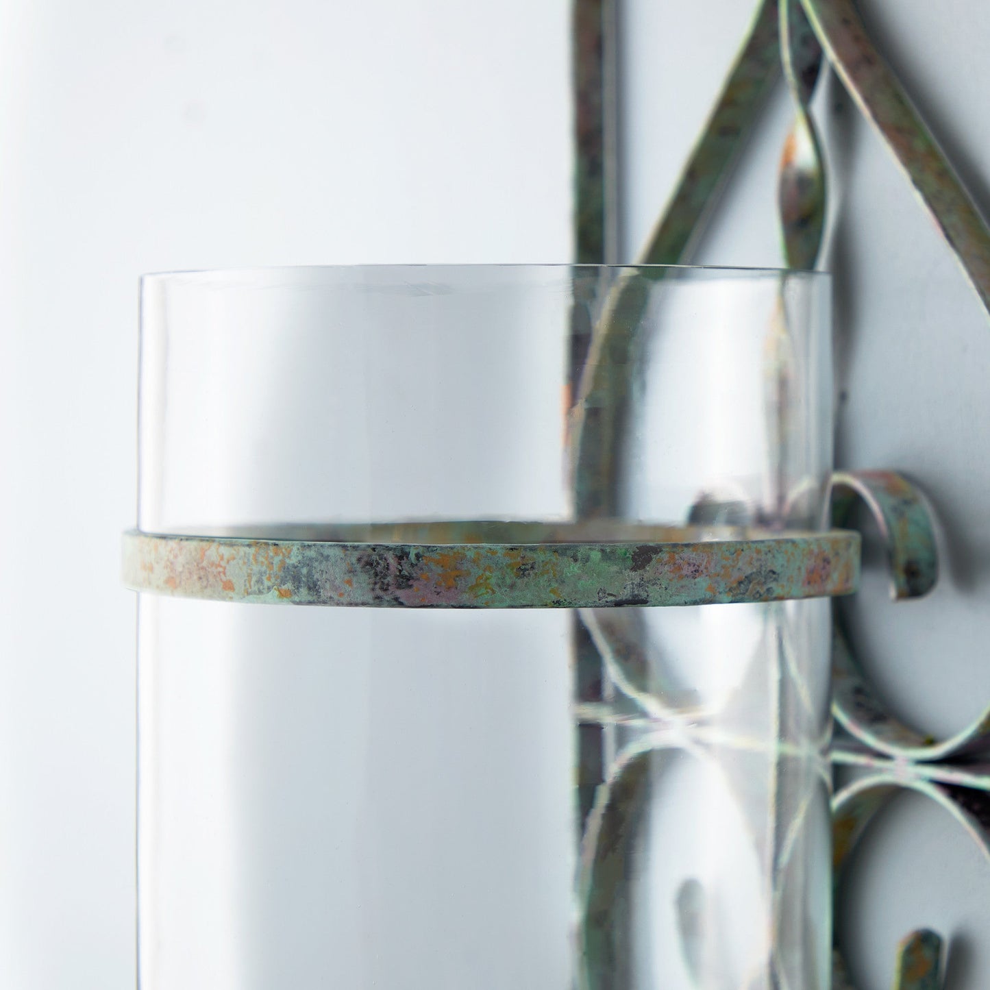 Tor wall mounted candle sconce in verdigris