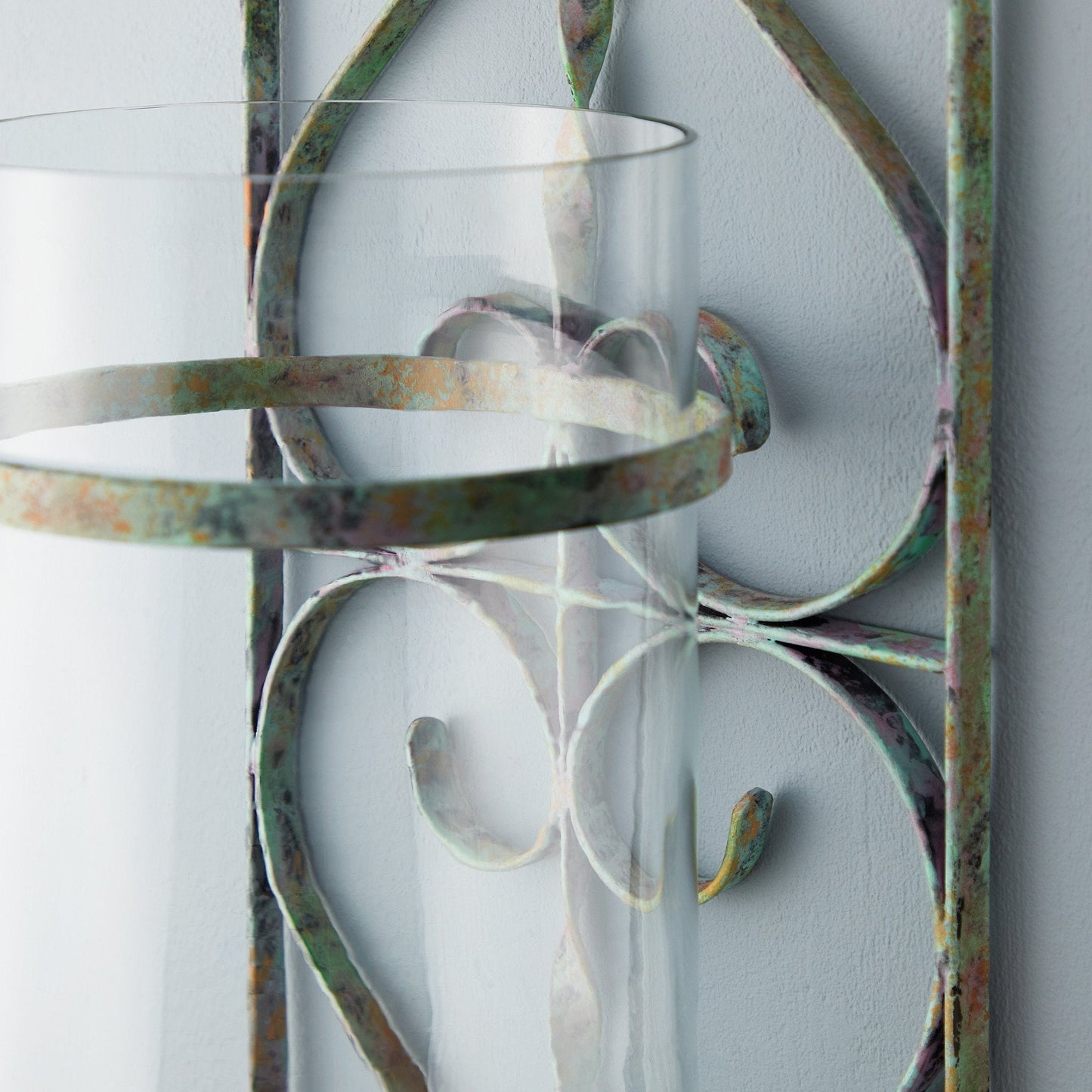 Tor wall mounted candle sconce in verdigris