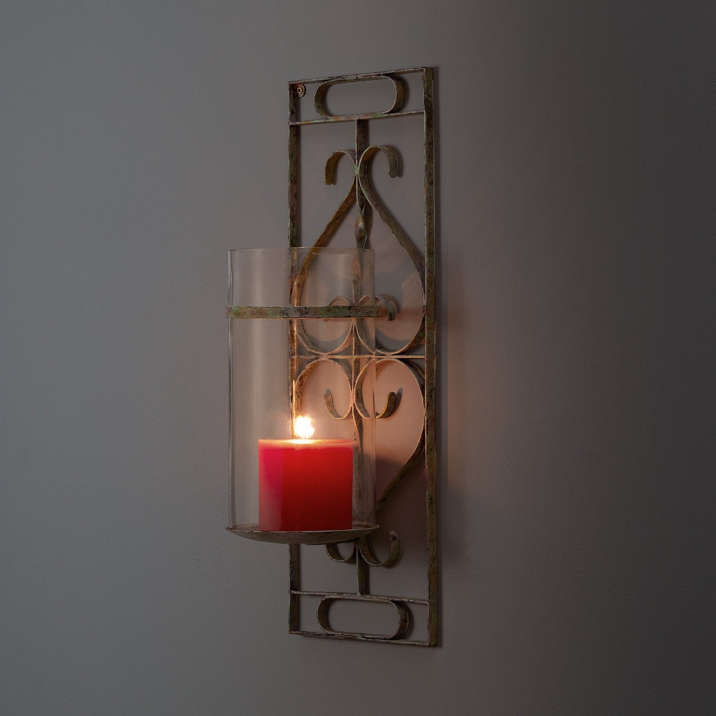 Tor wall mounted candle sconce in verdigris