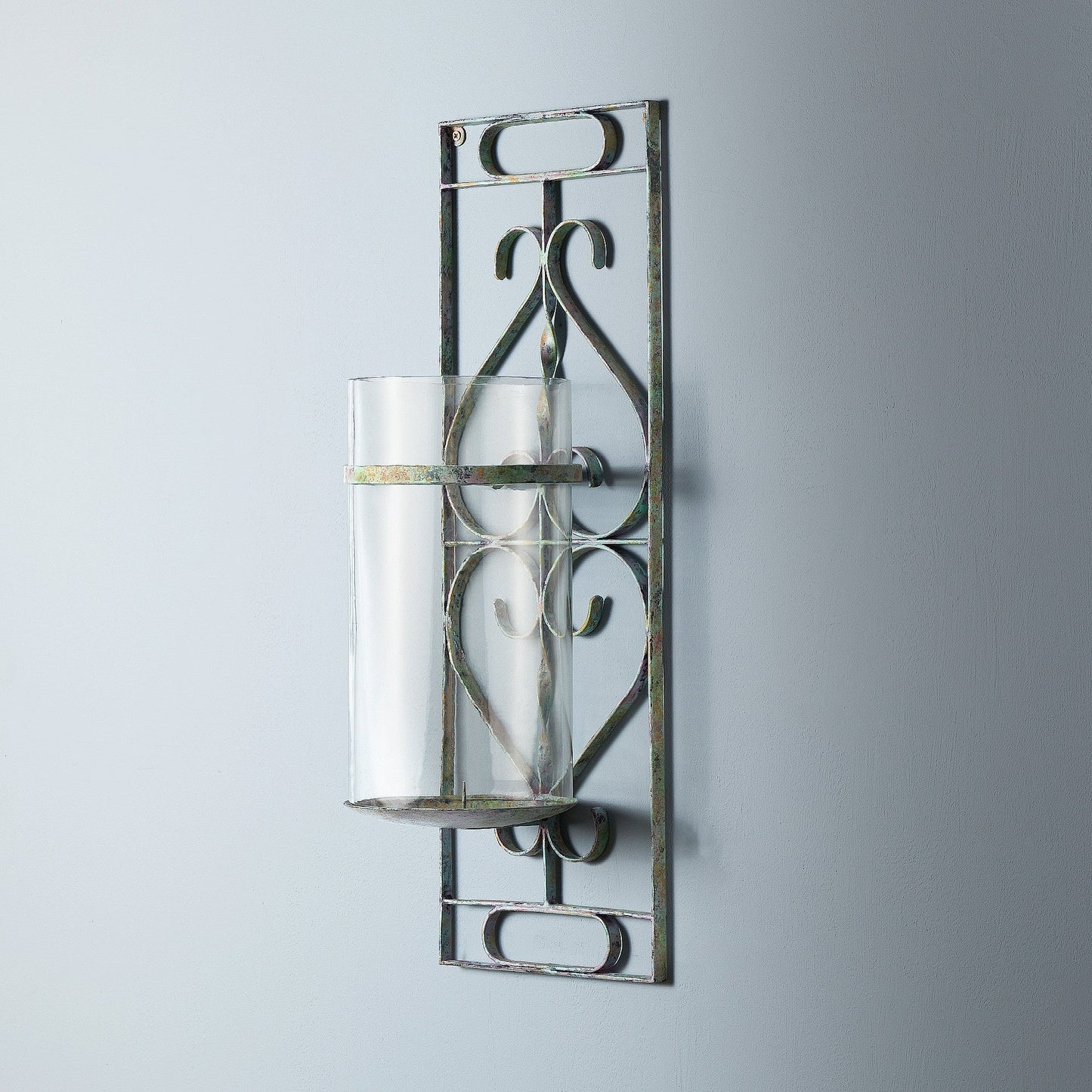 Tor wall mounted candle sconce in verdigris