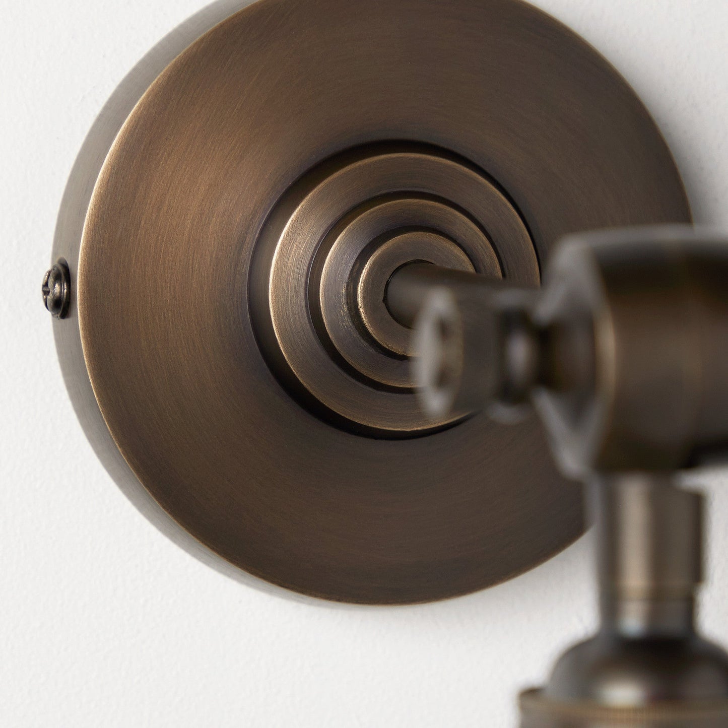 Elbow wall fitting in antiqued bronze