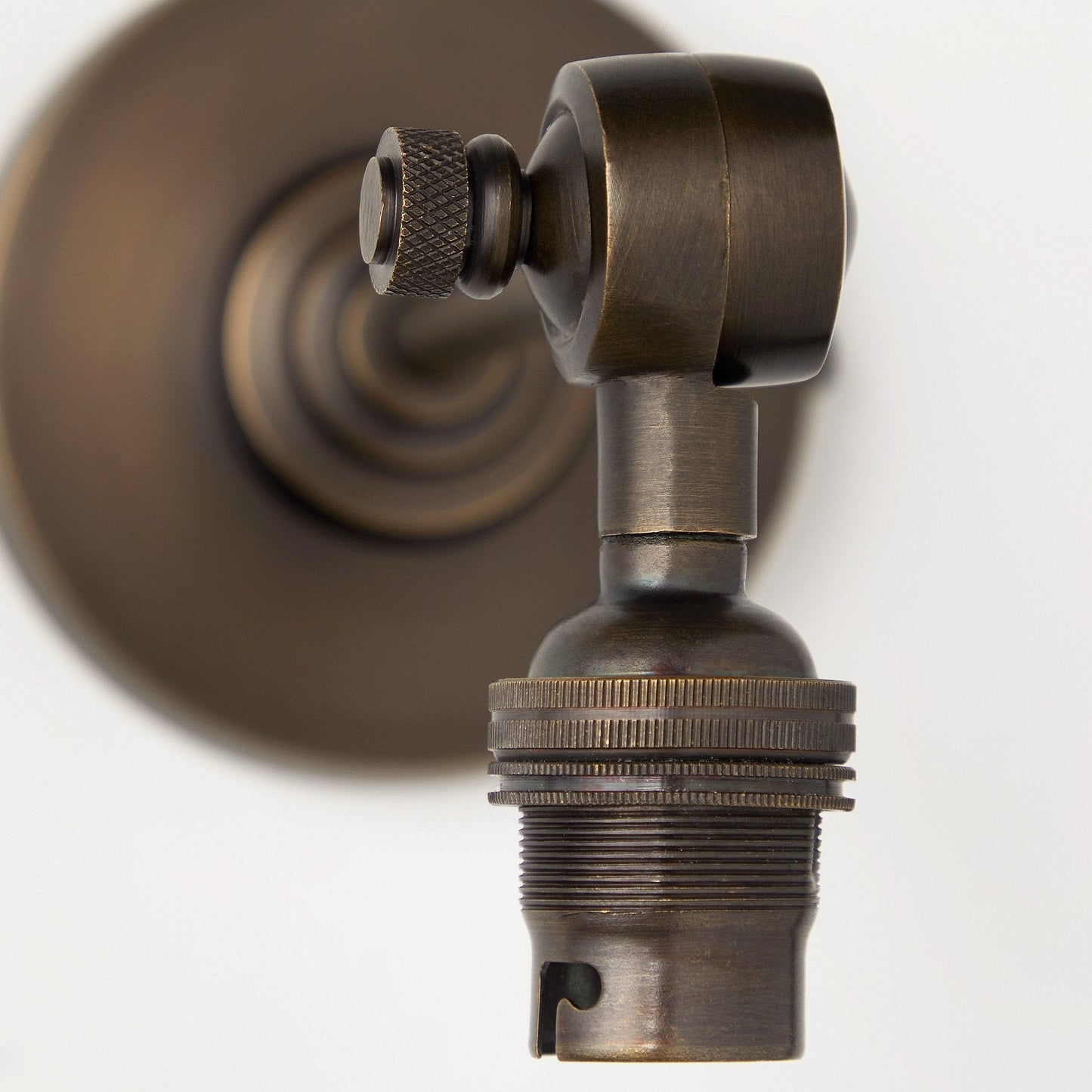 Elbow wall fitting in antiqued bronze