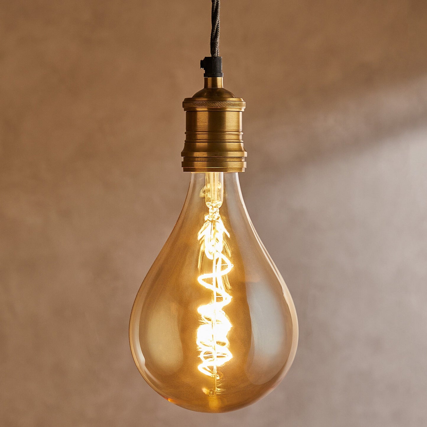 Giant 4 watt LED curled filament bulb with amber coating and E27 fitting