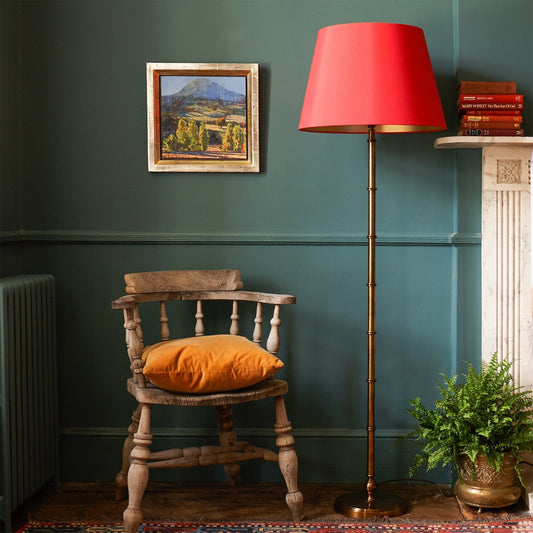 Chukka floor lamp in antiqued brass