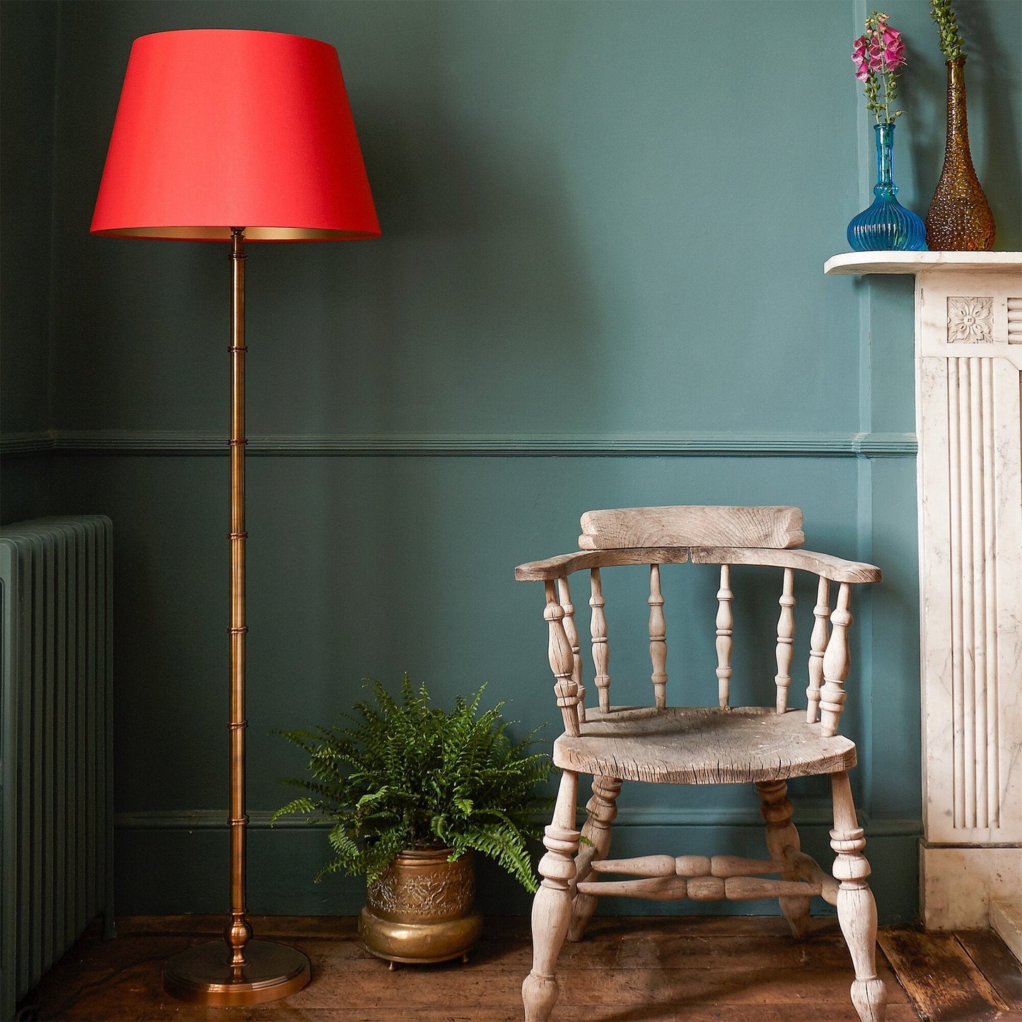 Chukka floor lamp in antiqued brass