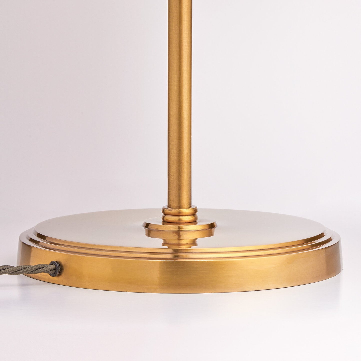 Double Swing standing lamp in antique brass