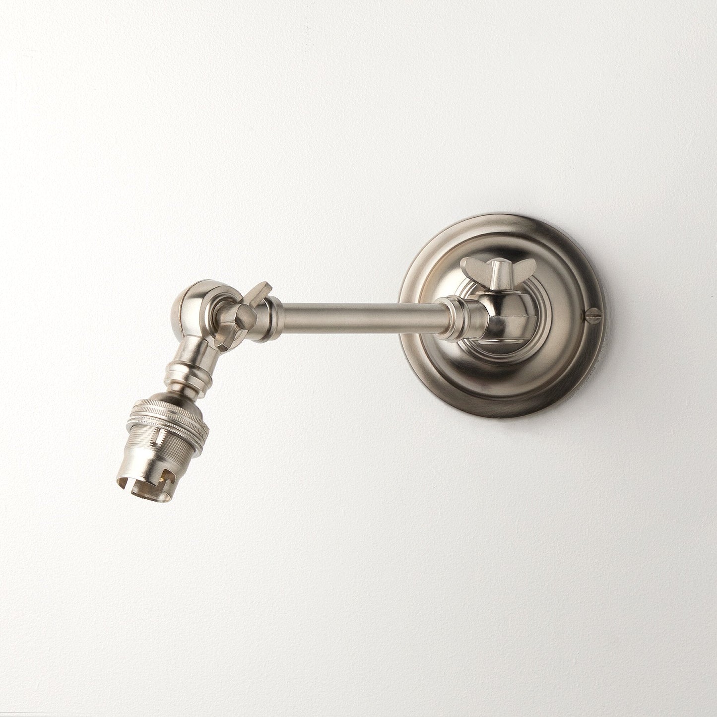 Double jointed wall fitting in antiqued silver