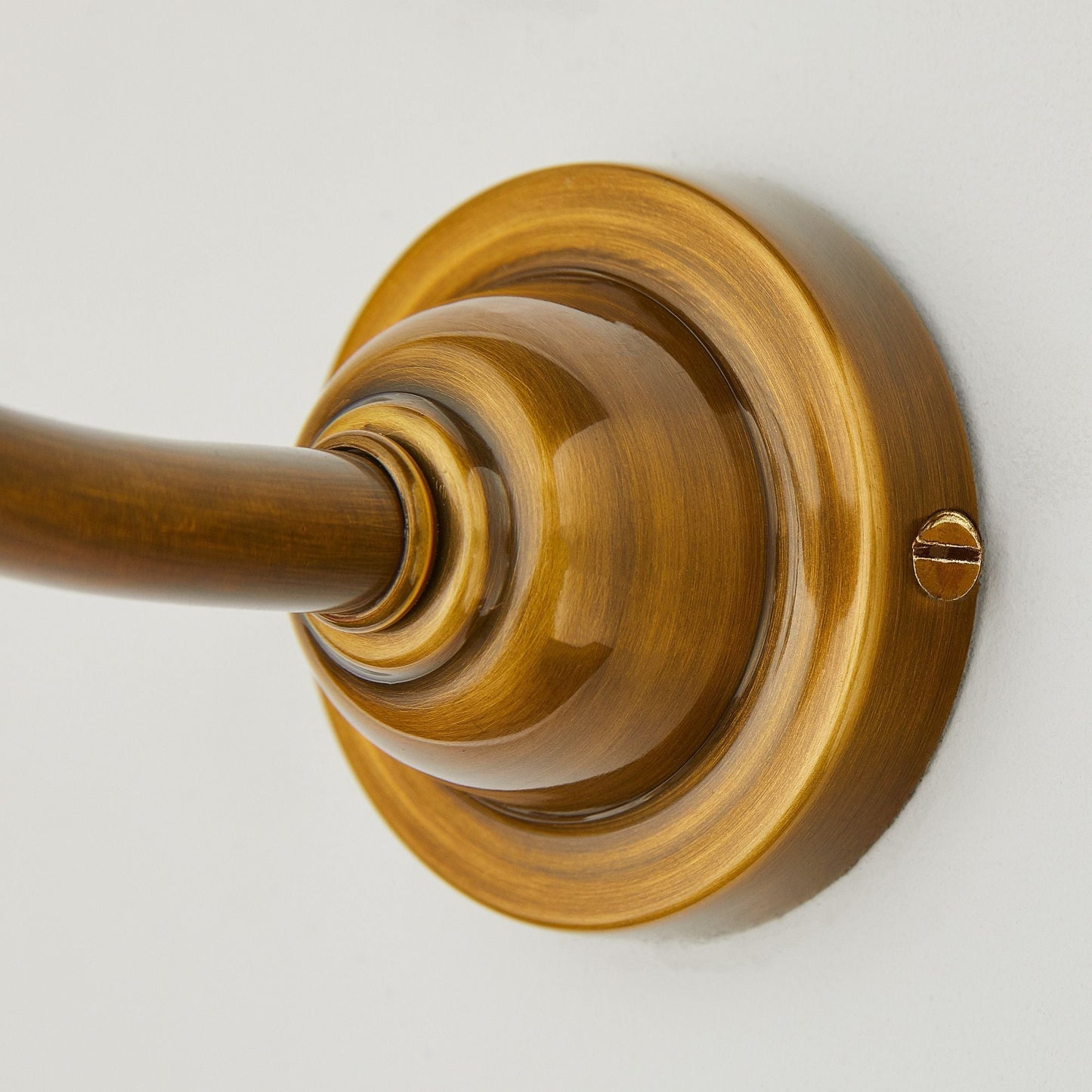 Swan neck wall fitting in antiqued brass
