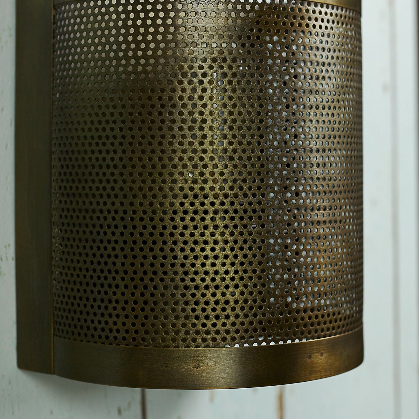 Scoville wall light in perforated brass