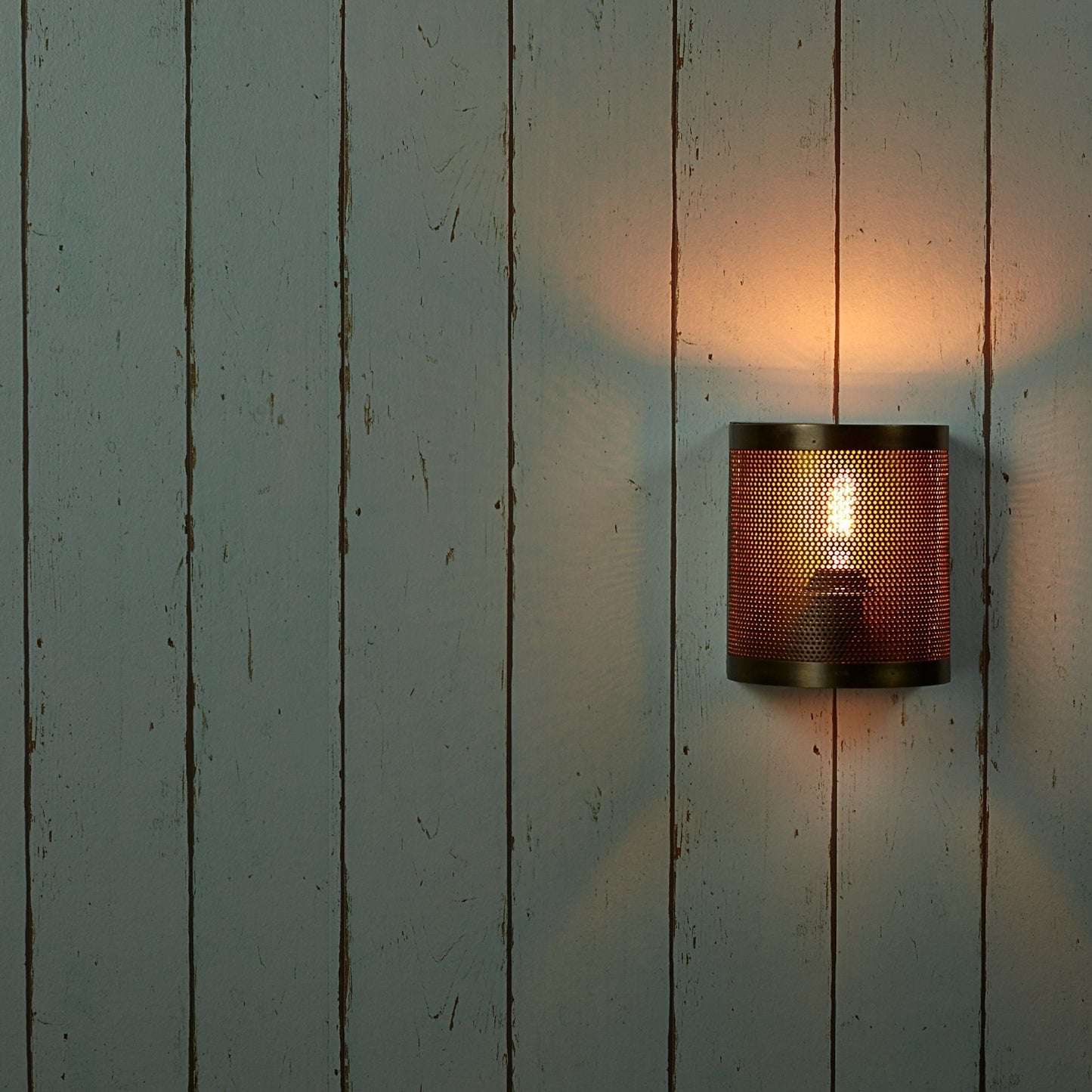 Scoville wall light in perforated brass