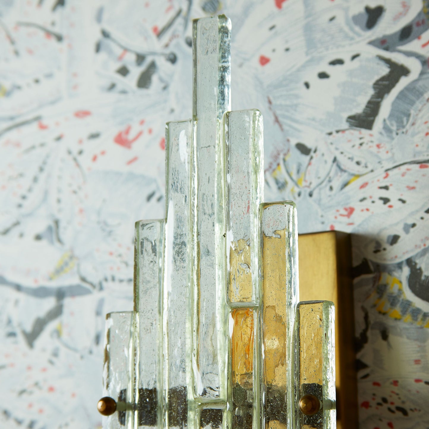 Skystar wall sconce with stepped clear recycled glass strips