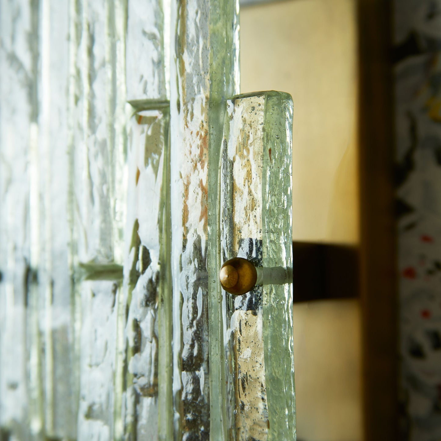 Skystar wall sconce with stepped clear recycled glass strips