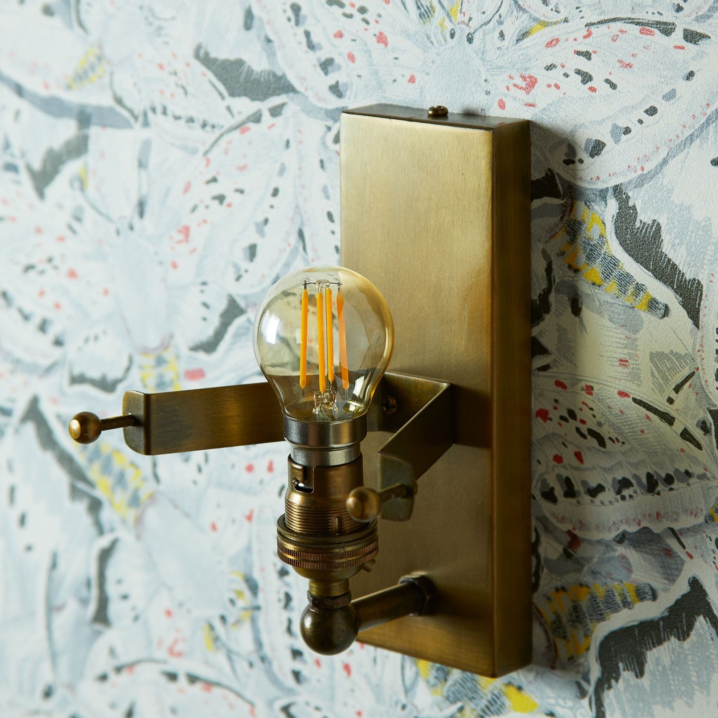 Skystar wall sconce with stepped clear recycled glass strips